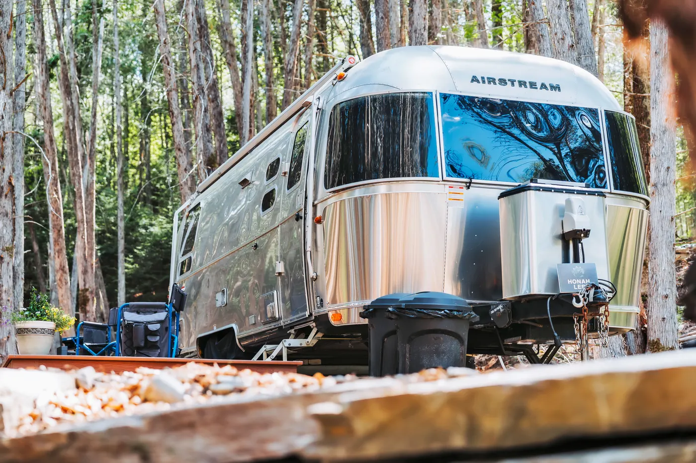 Airstream exterior from the cedar-grove path