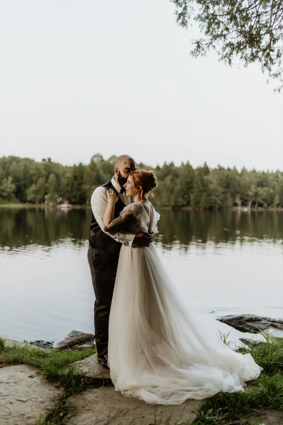 A newly married couple beside Manhanock Pond