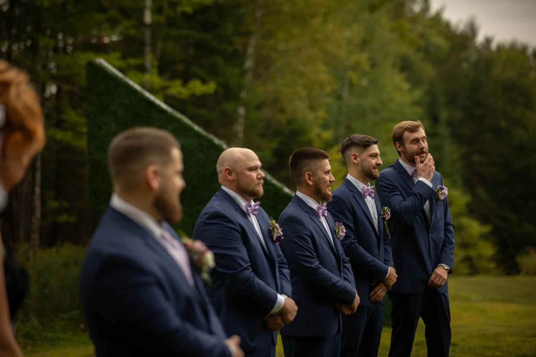 Groomsmen gathered at a Dragonwood ceremony site