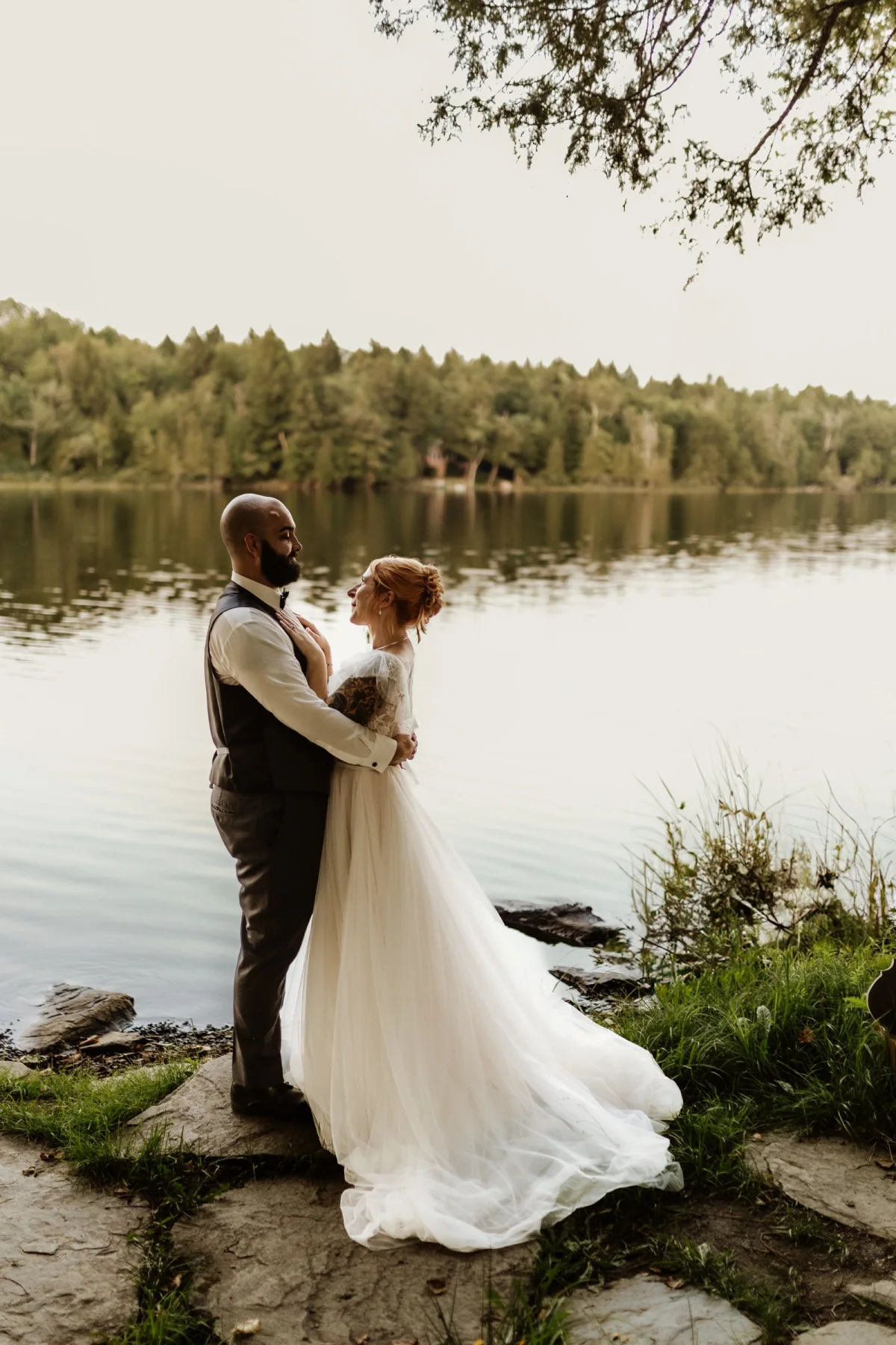 Wedding couple beside Manhanock Pond