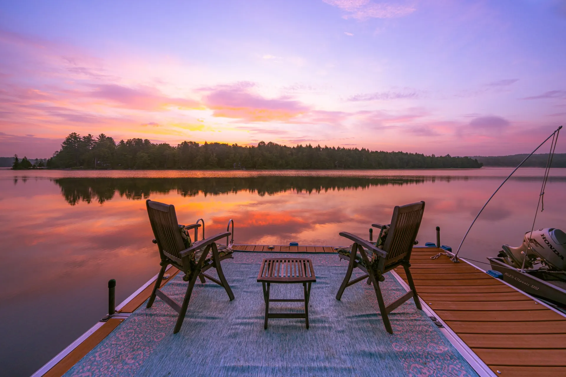 Friends gathered on the private dock at Dragonwood in Parkman Maine