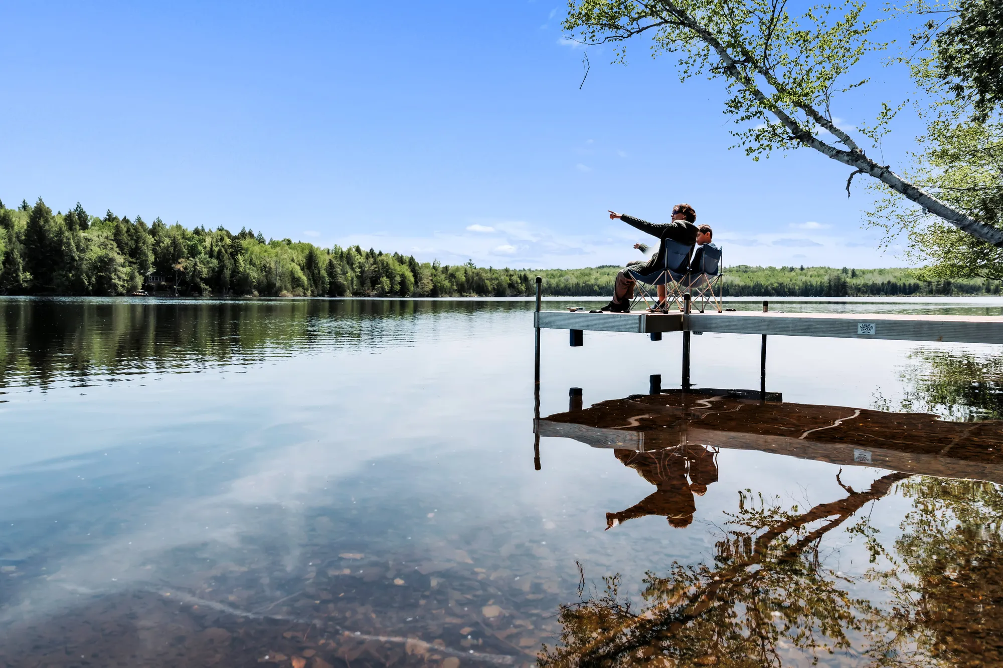 Family relaxing together on the dock
