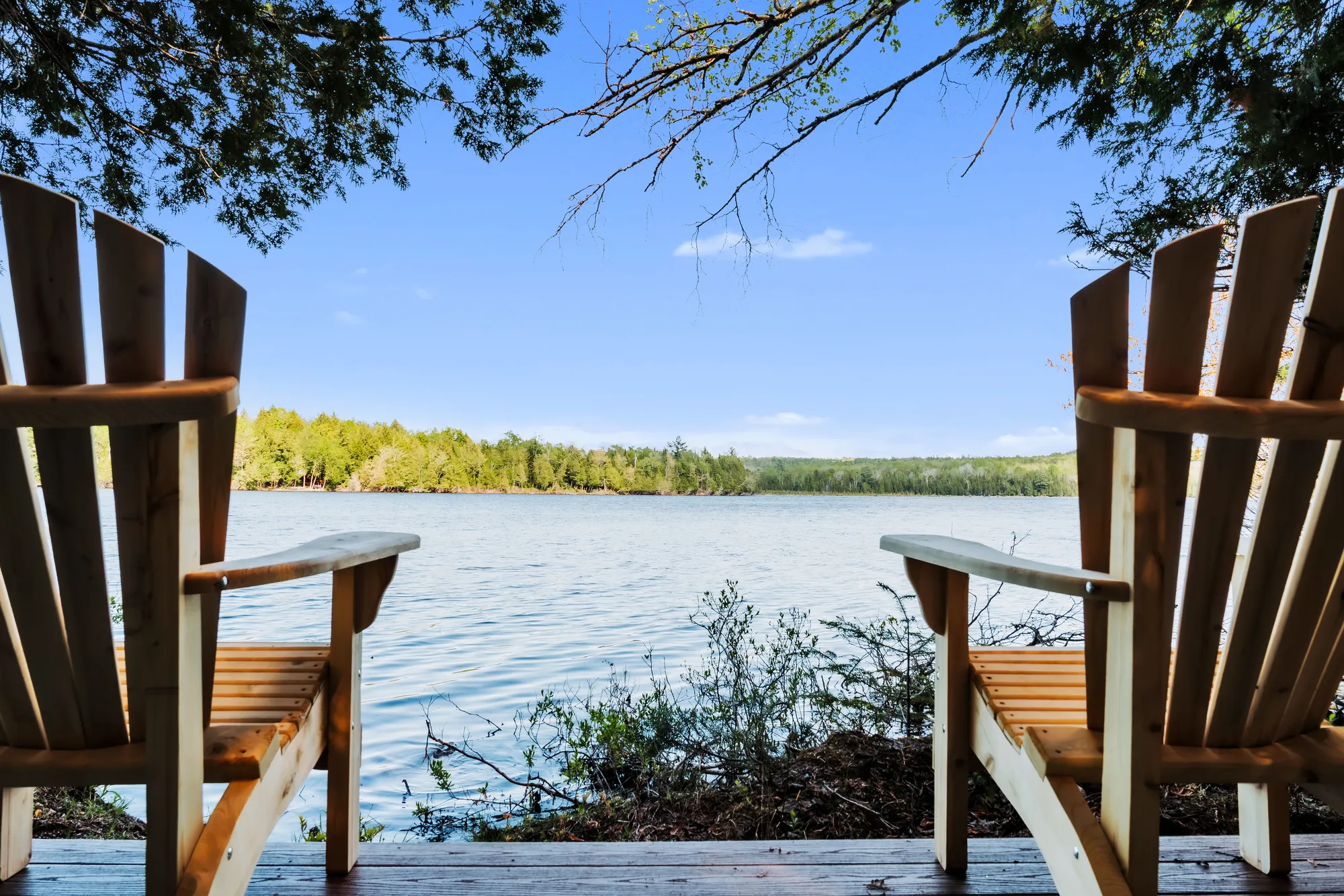 Adirondack chairs overlooking Manhanock Pond